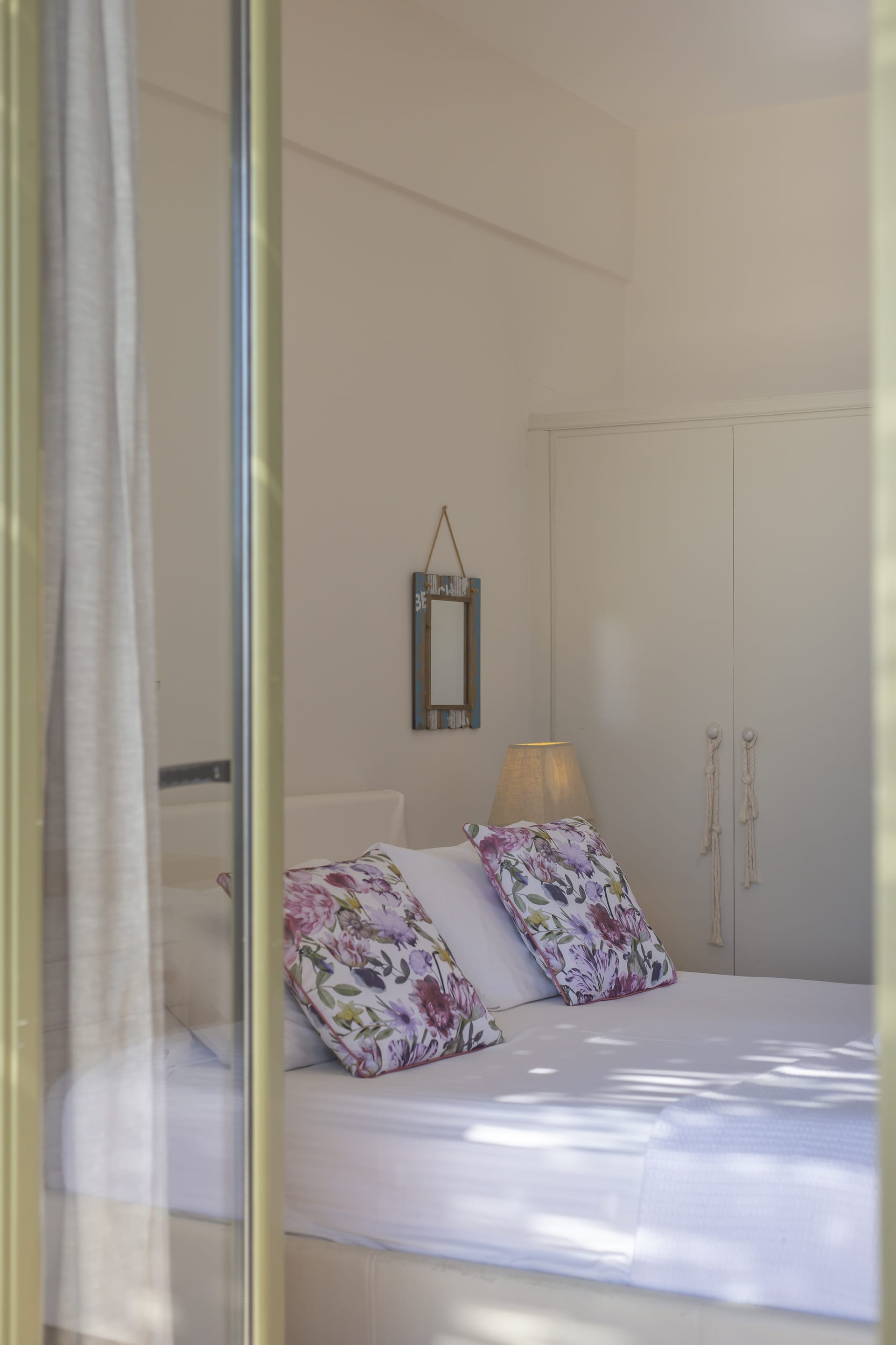 a bed with a lamp on the side