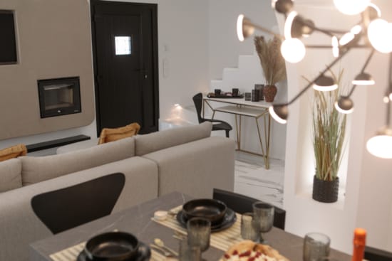 a living room with a table and chairs