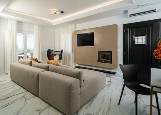 a living room with a couch and a tv