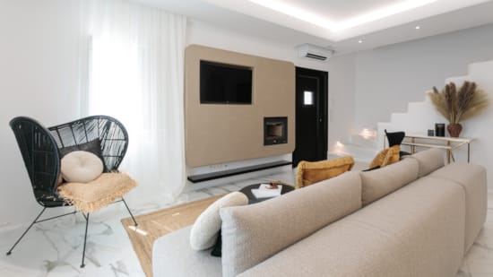 a living room with a couch and a tv