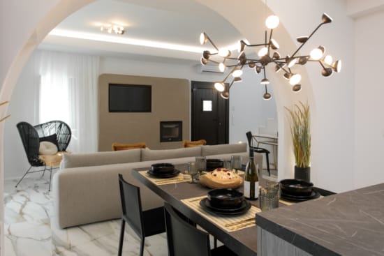 a dining table with a chandelier above it