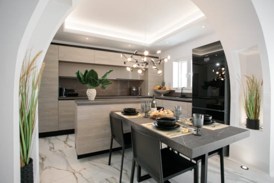 a kitchen with a dining table and chairs