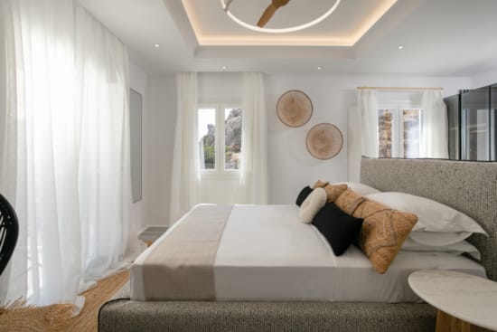 a bedroom with a bed and a couch