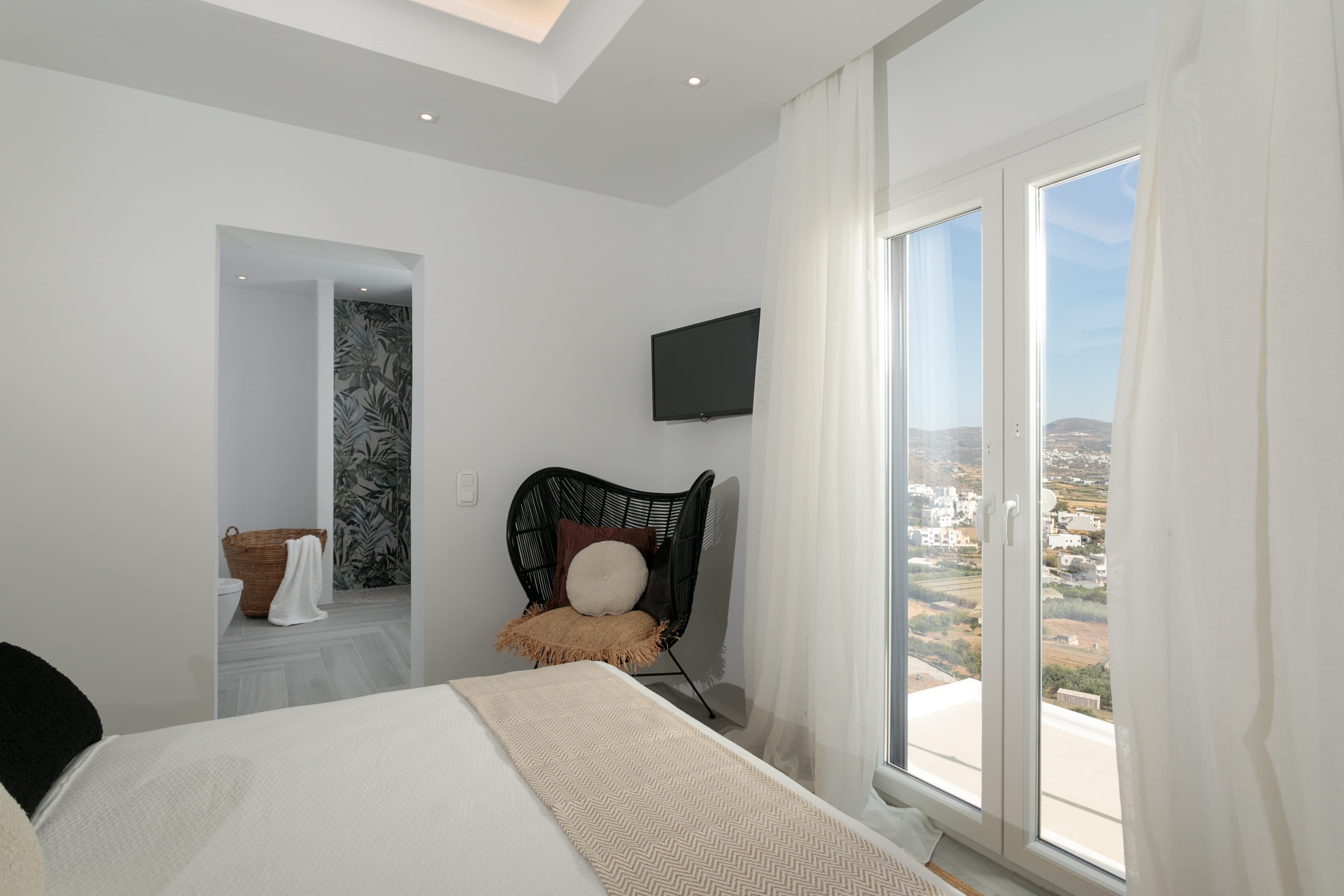 a bedroom with a bed and a chair