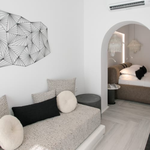 a room with a couch and a mirror