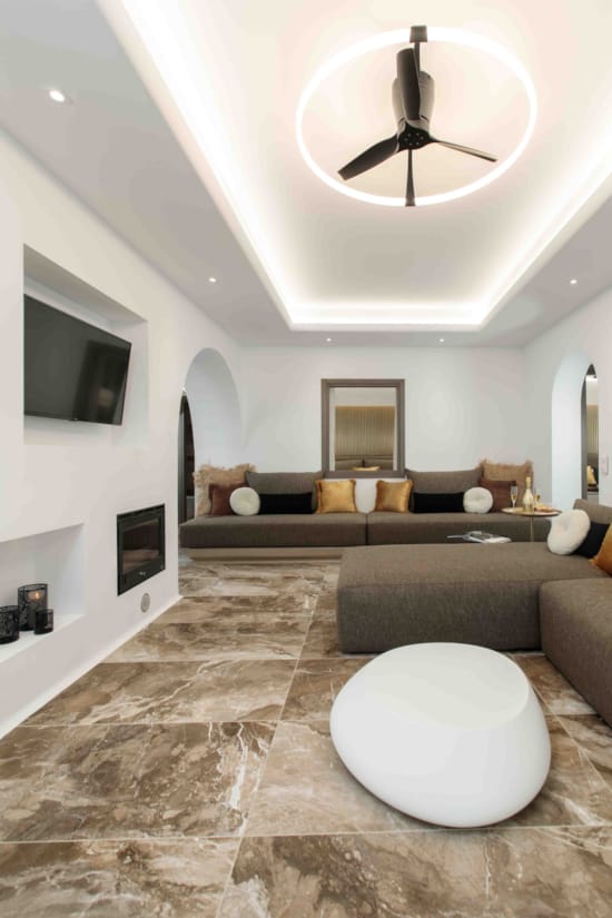 a living room with a large chandelier and a couch