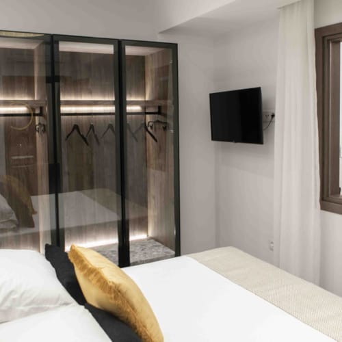 a bed with a glass door