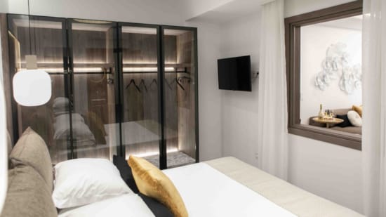 a bed with a glass door
