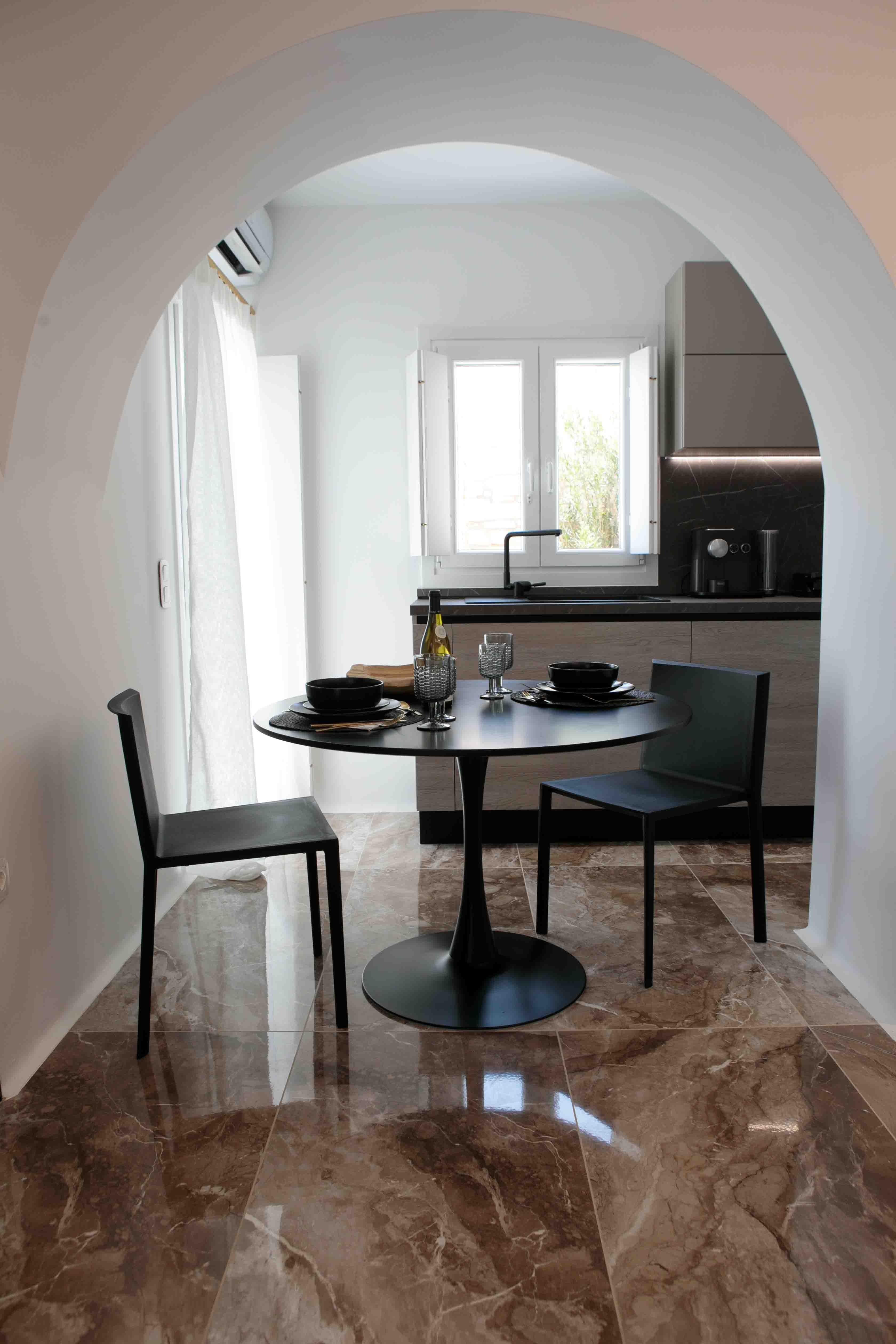 a table with chairs and bottles on it