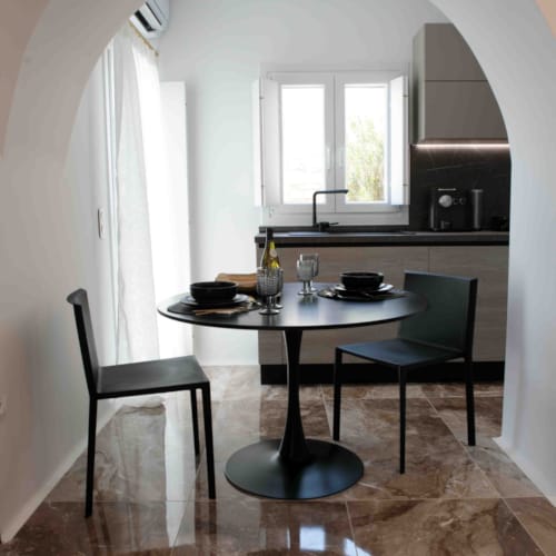 a table with chairs and bottles on it