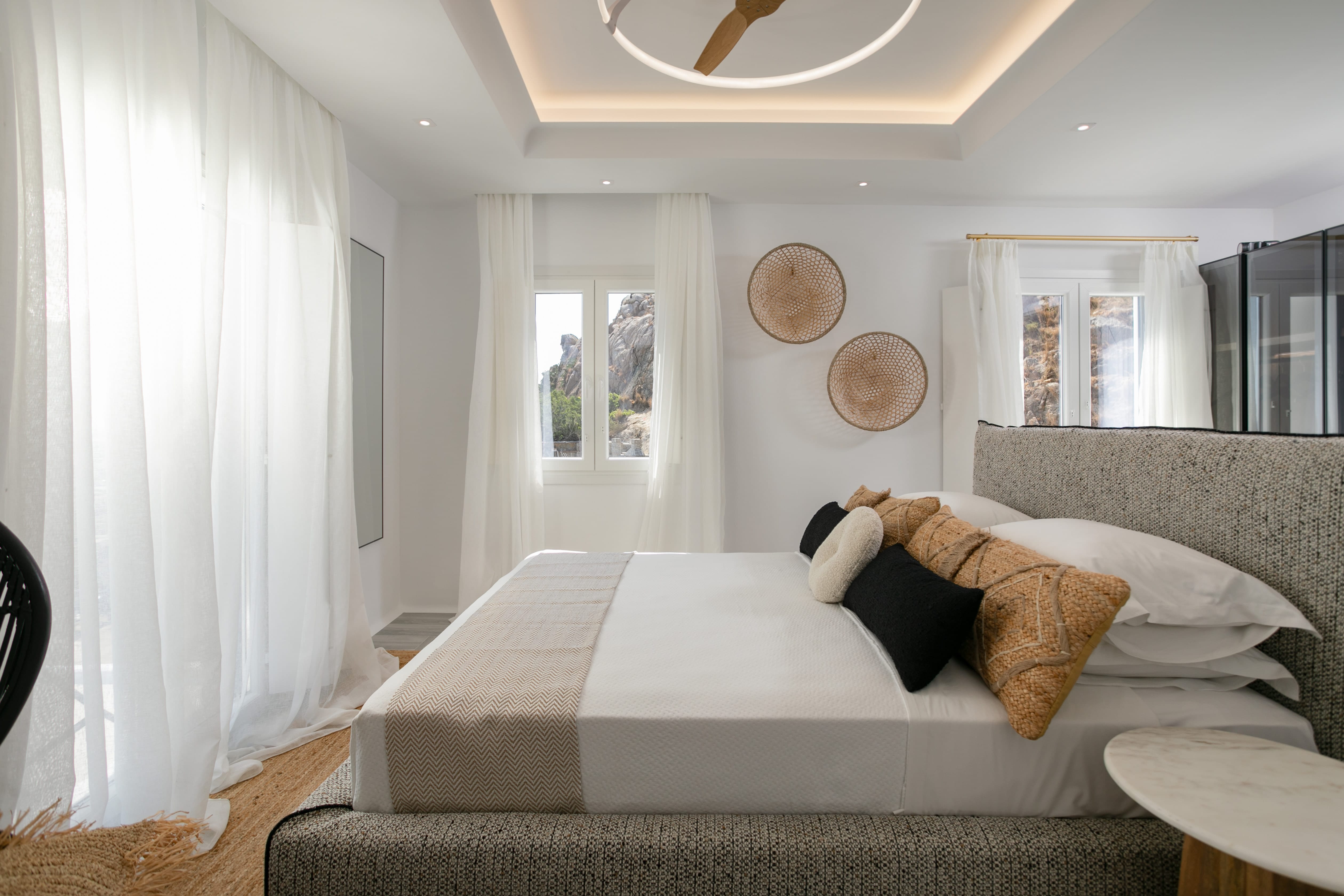 a bedroom with a bed and a couch