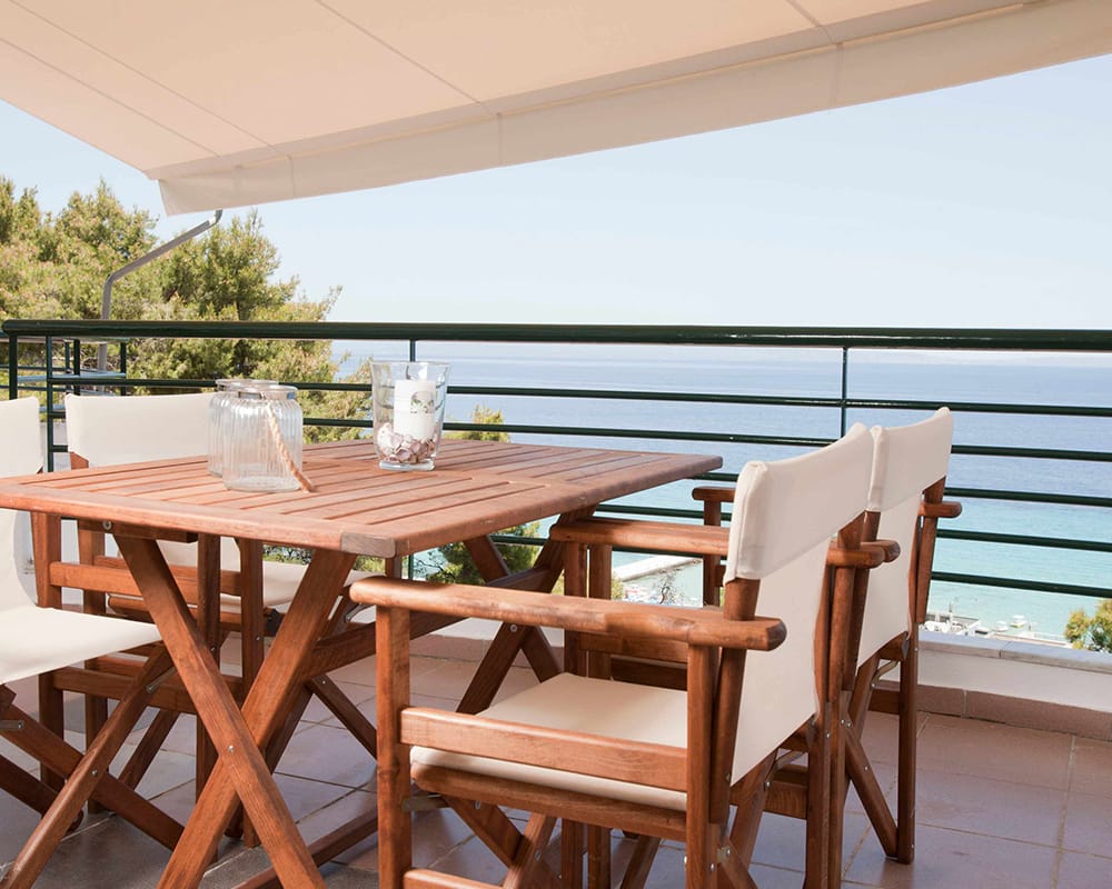 a table and chairs on a deck