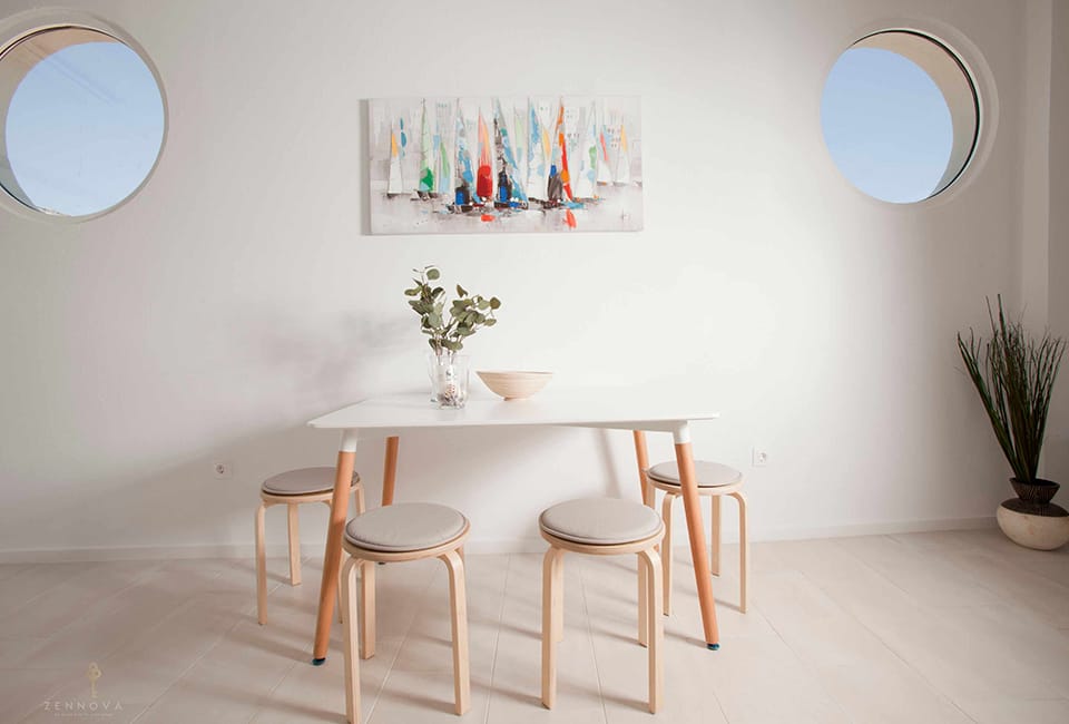 a table with stools and a plant on it