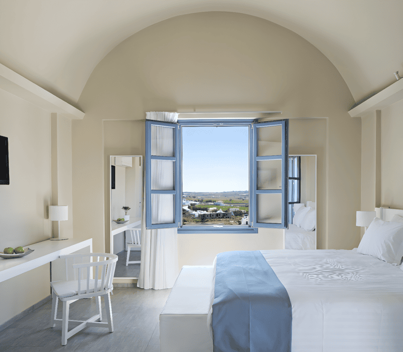 a bedroom with a bed and a tv