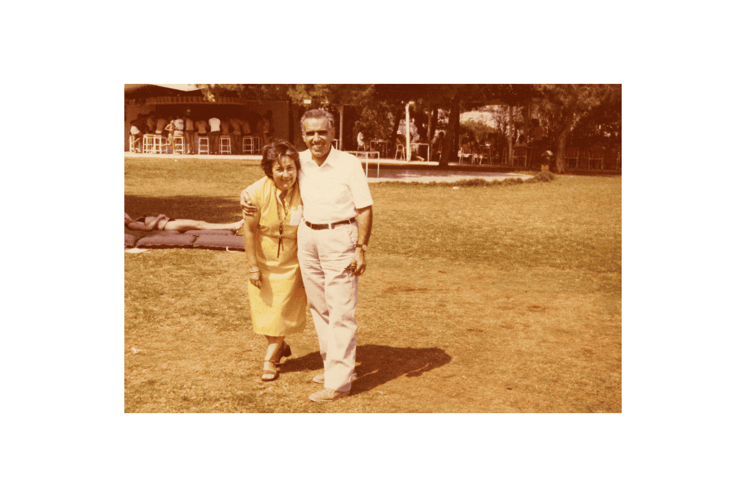 a man and a woman standing in a field