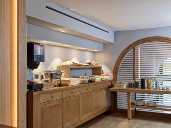 a kitchen with a tv and a table