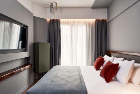 a bed with a white bed spread