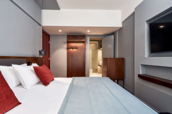 a hotel room with two beds