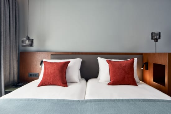 a bed with white sheets