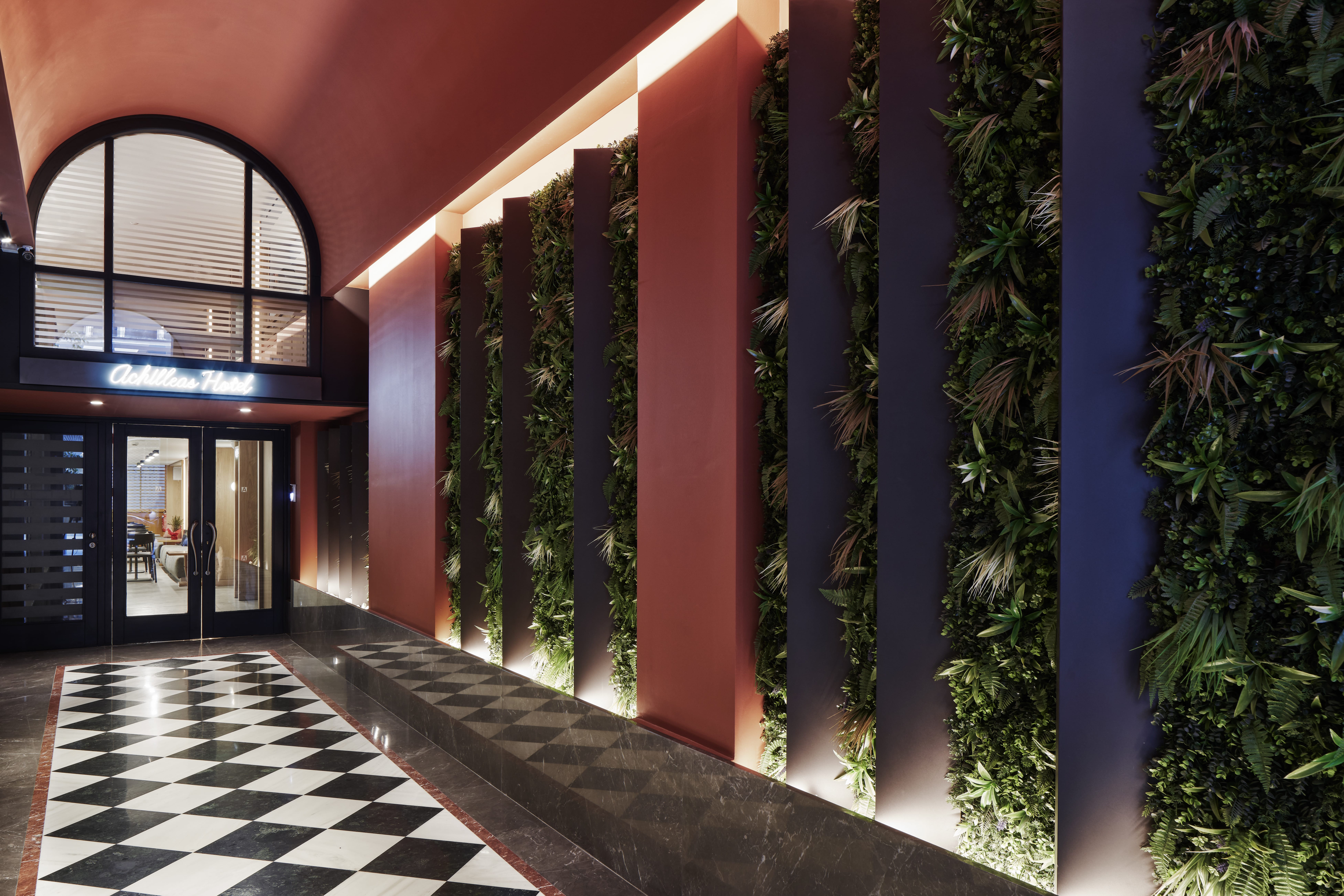 a building with plants in the front