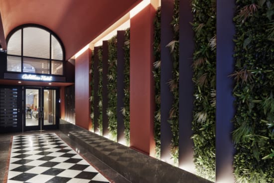 a building with plants in the front