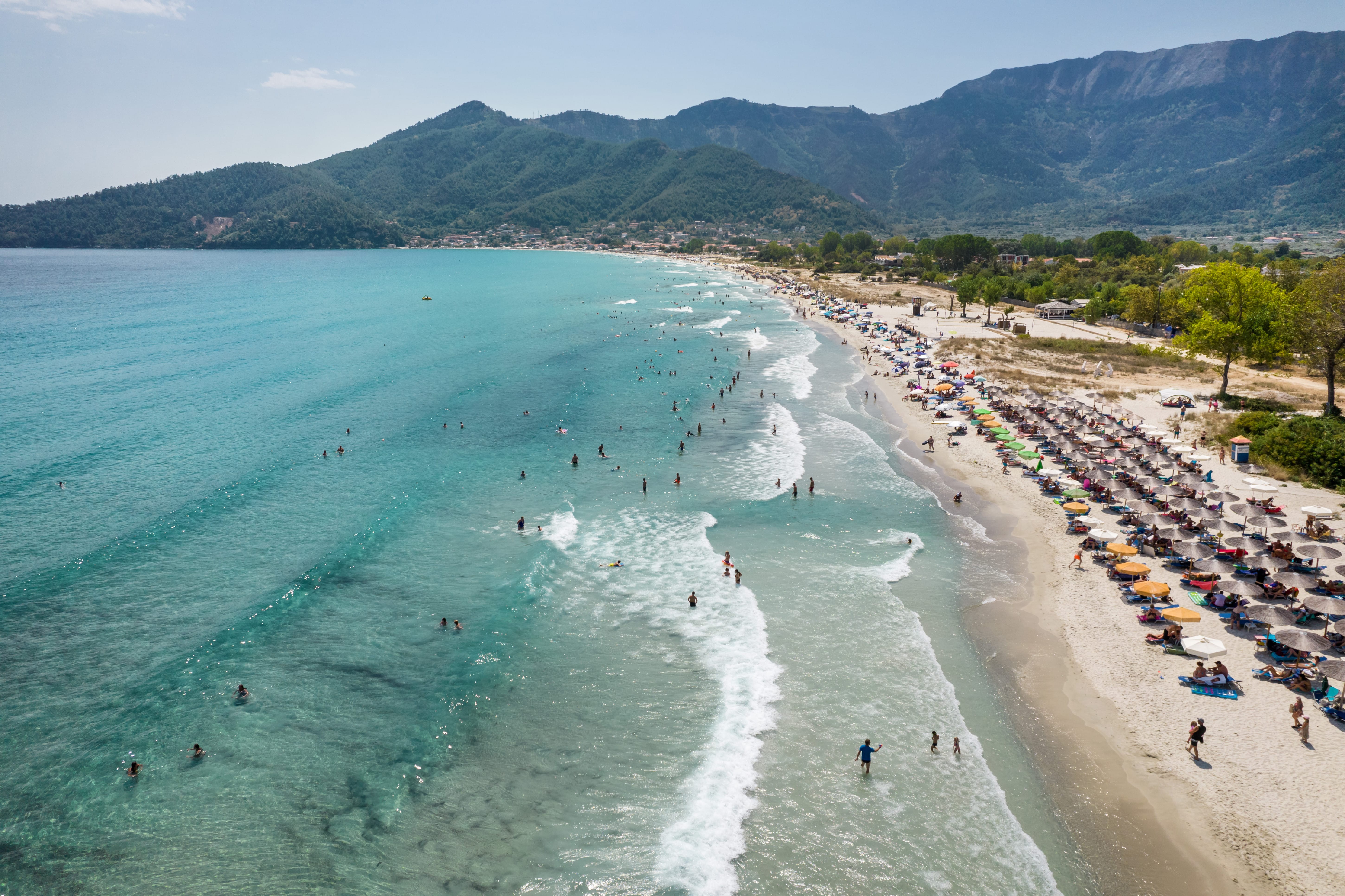 a beach with people on it