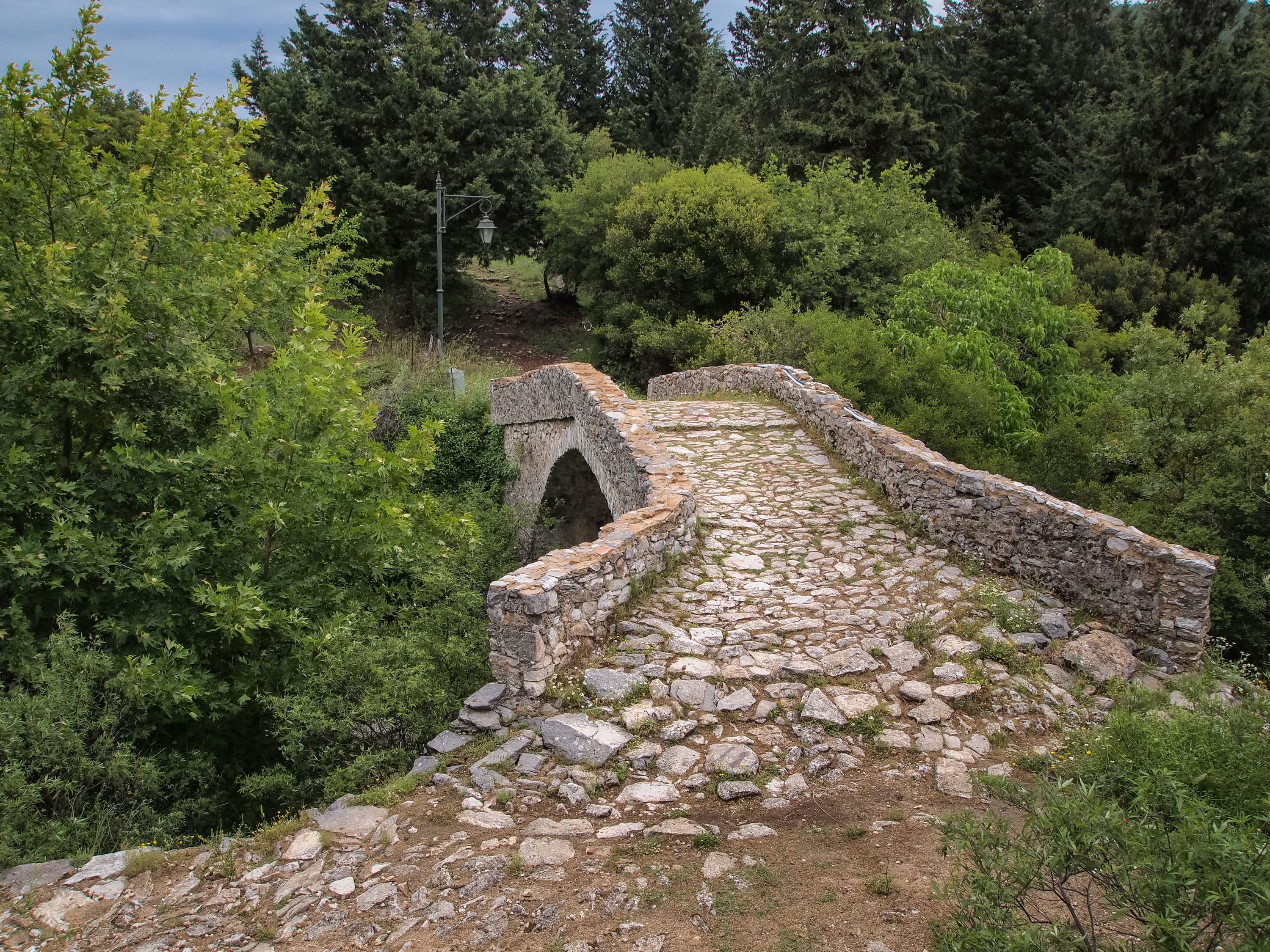 a stone wall with a tunnel