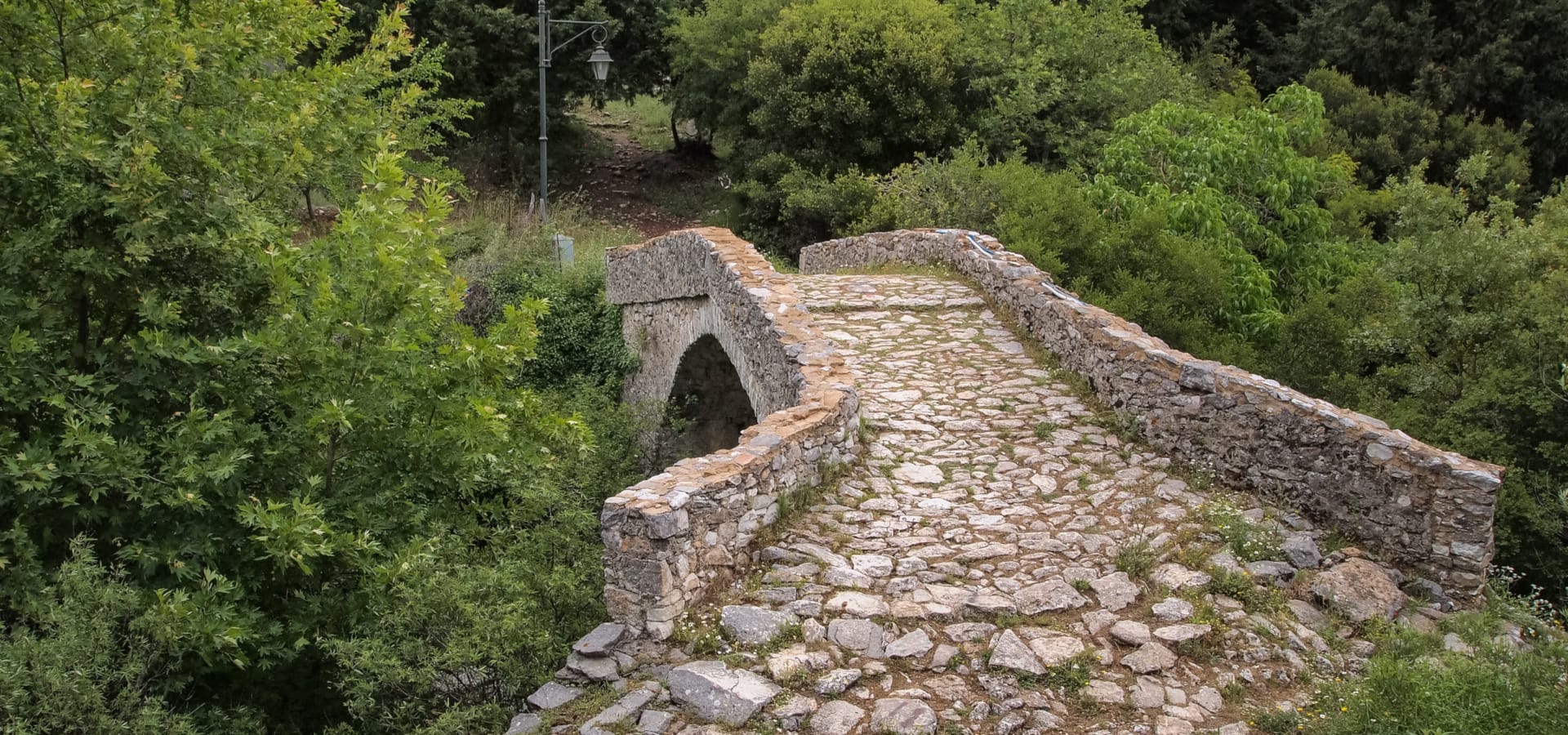 a stone wall with a tunnel