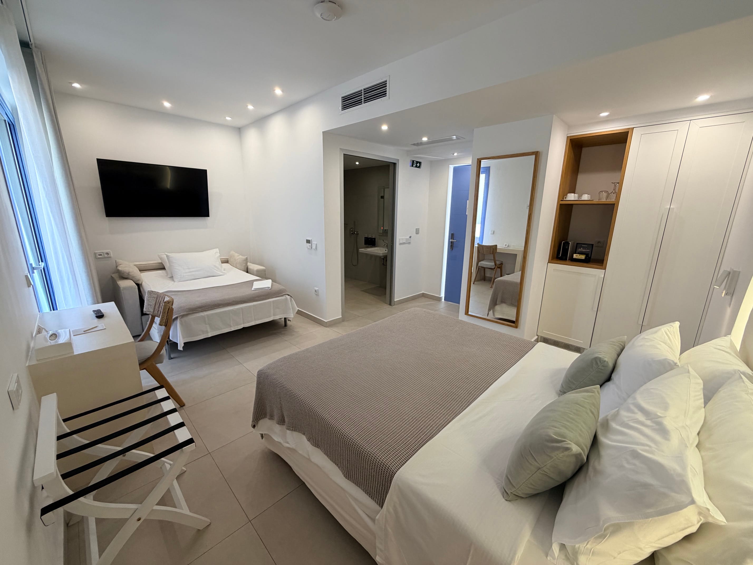 a room with a bed and a tv
