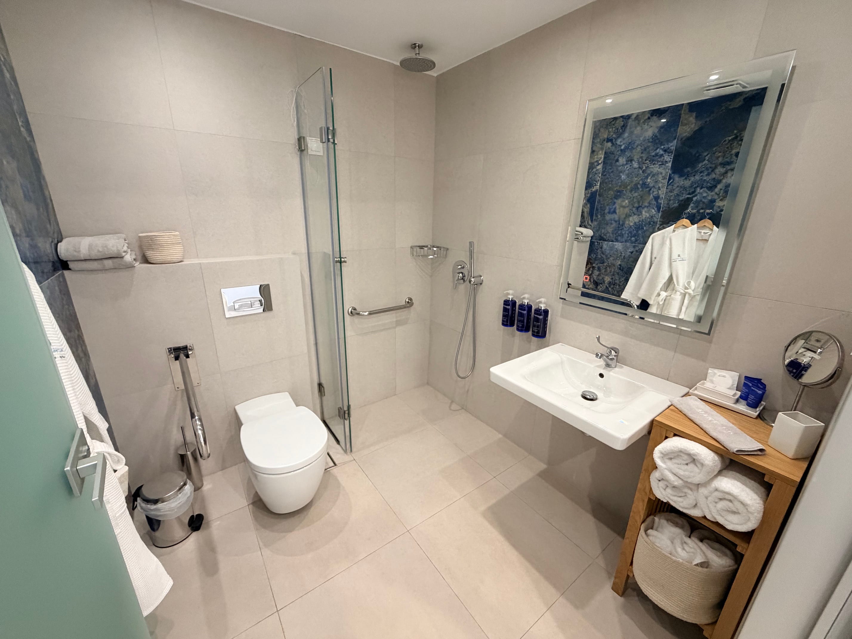 a bathroom with a shower and toilet