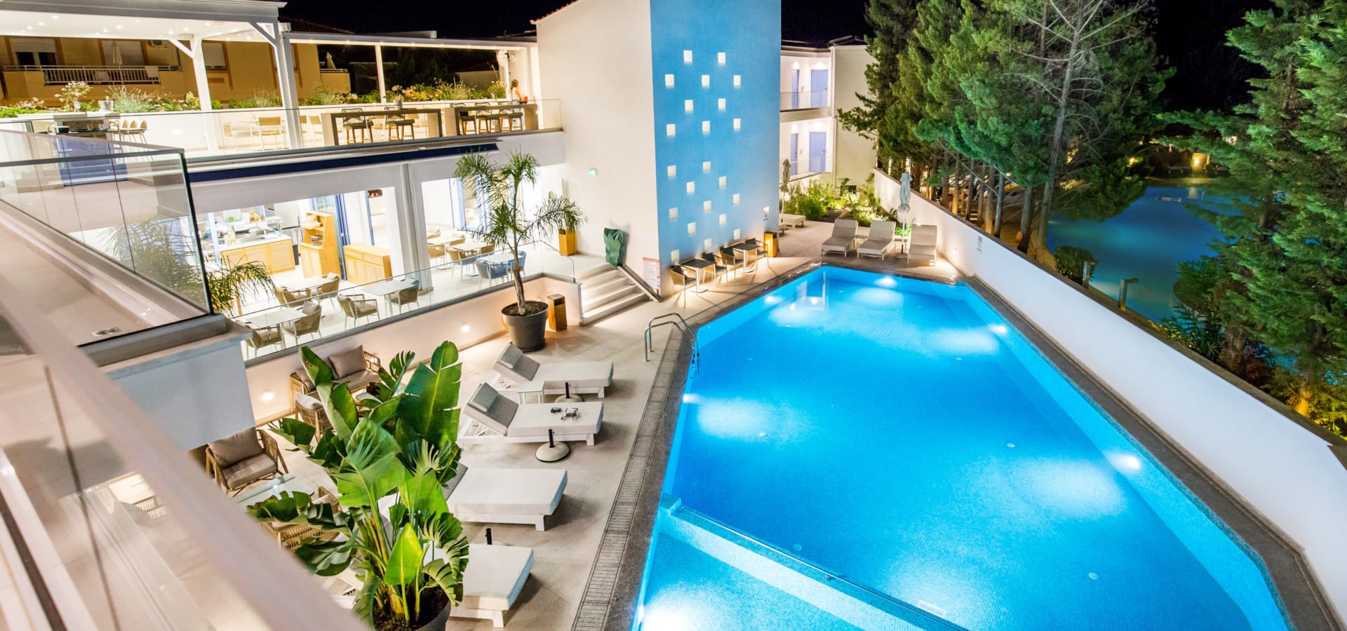 a swimming pool with a building in the background