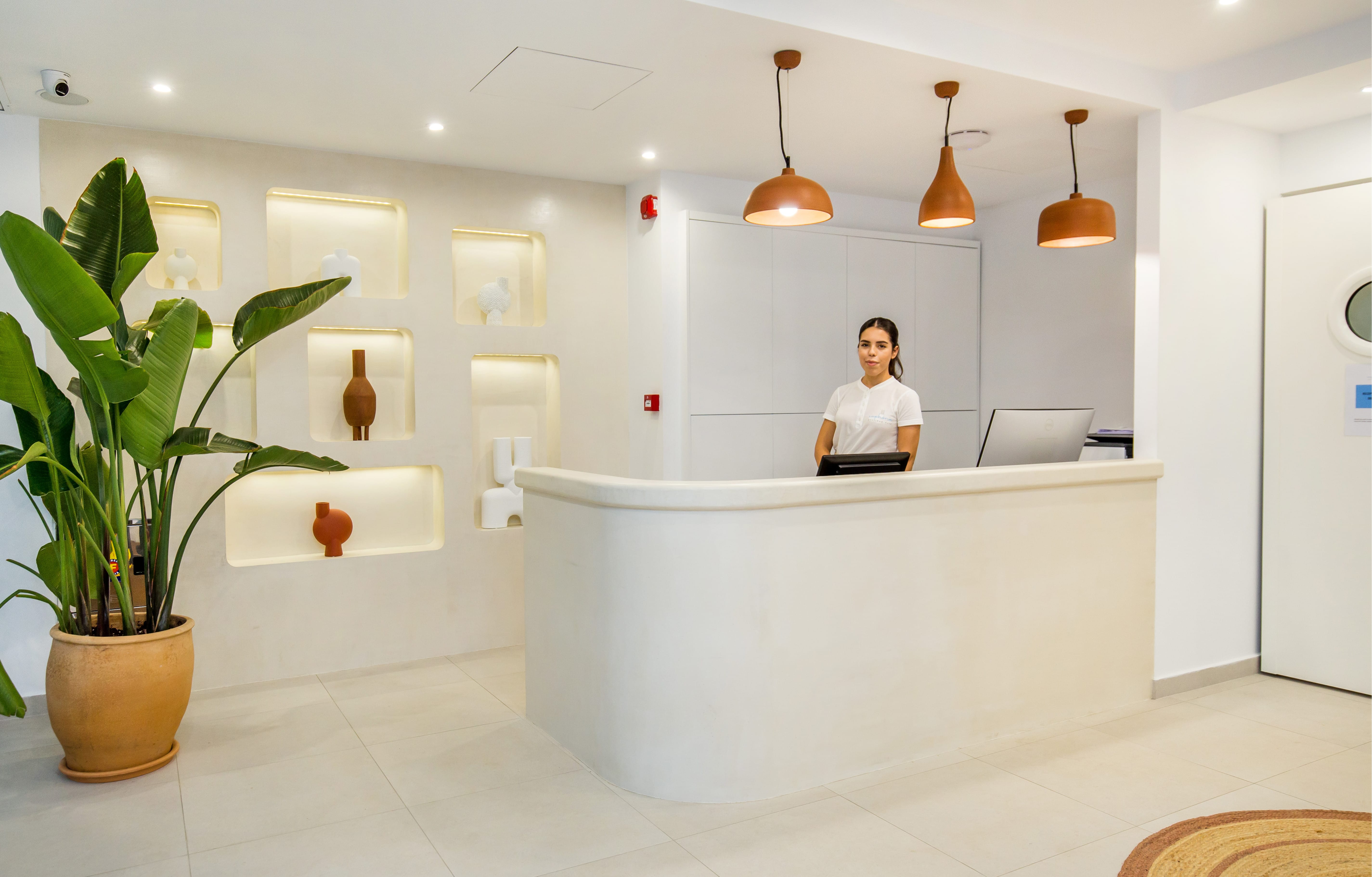a person sitting at a desk in a bathroom