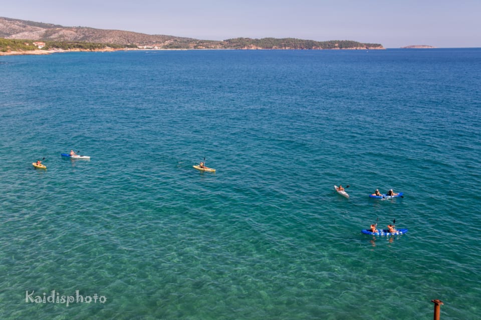 a group of people swimming in a large body of water