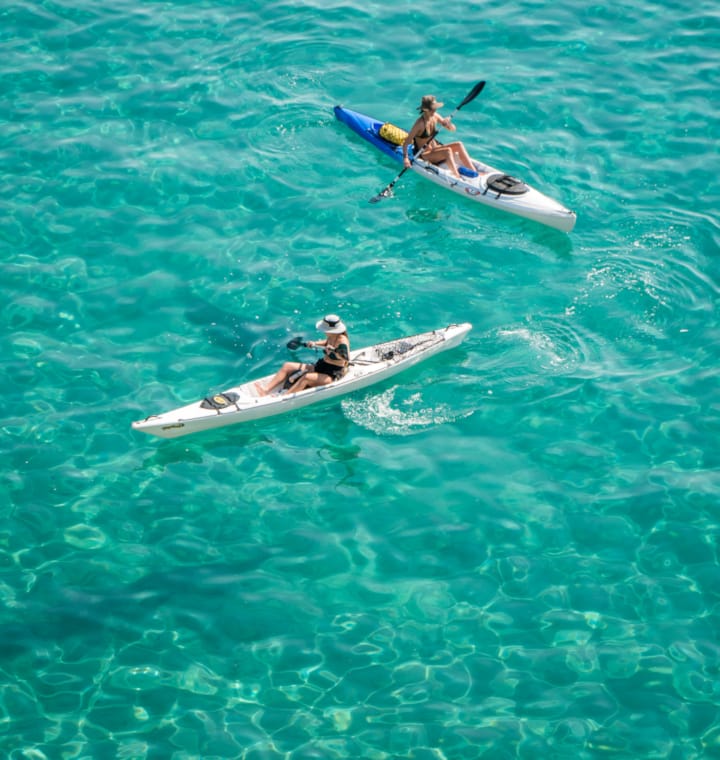 two people in a small boat
