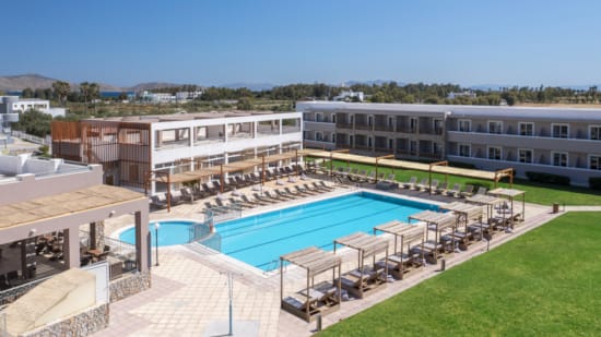 a large building with a pool