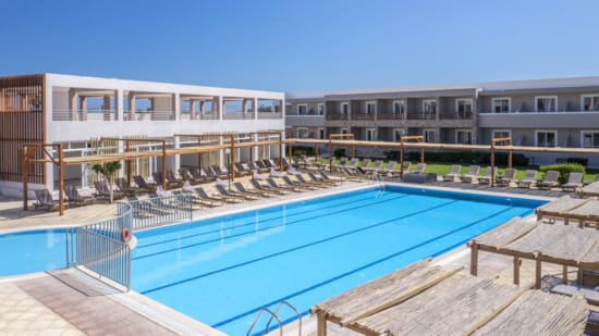 a swimming pool in front of a building