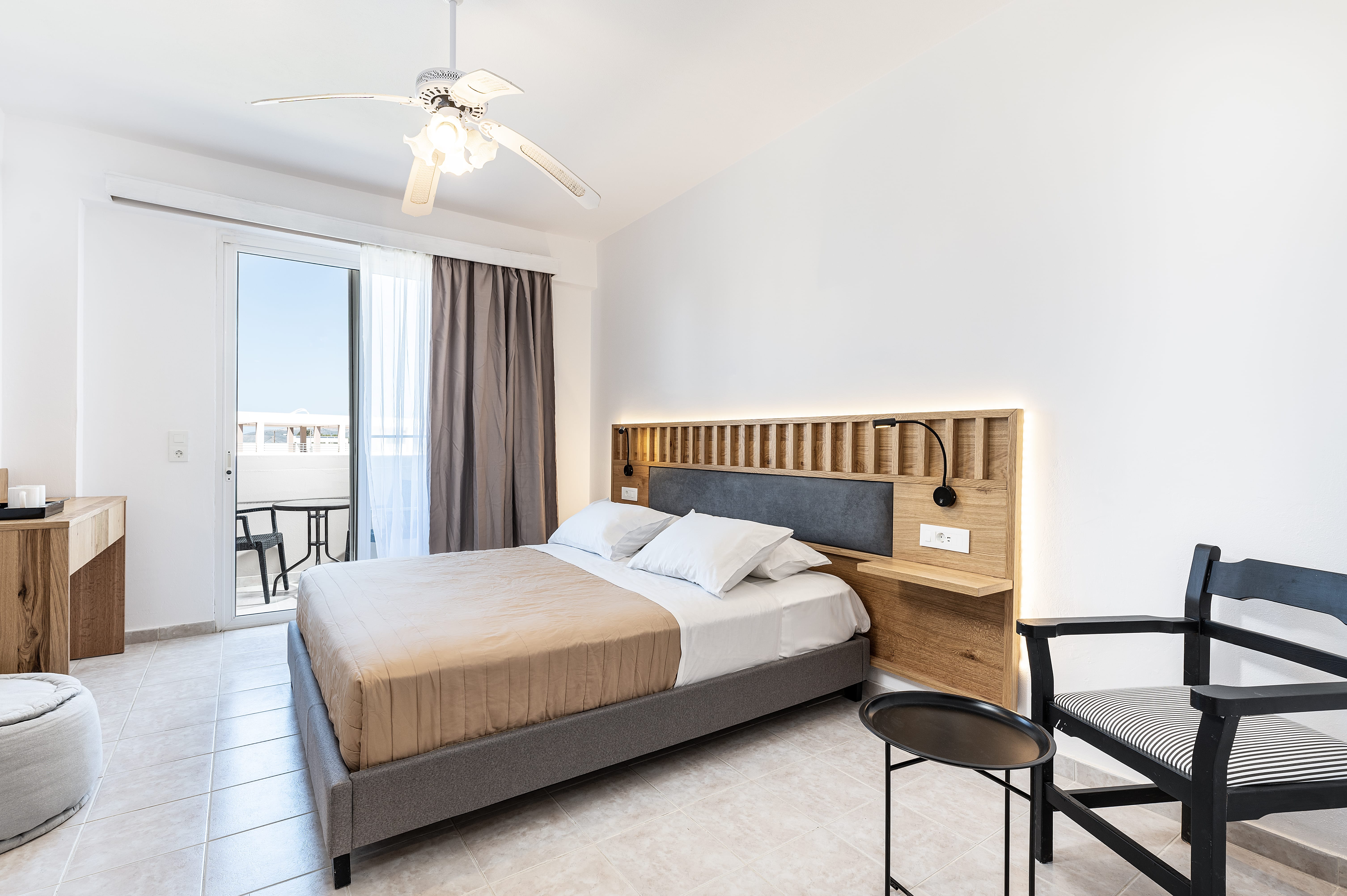 a bedroom with a bed and a chair