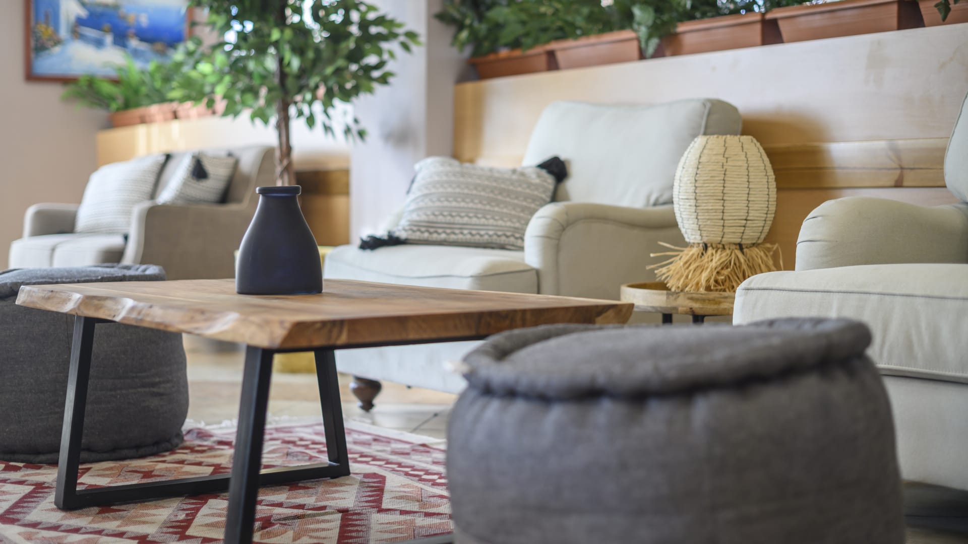 a living room with a coffee table and chairs