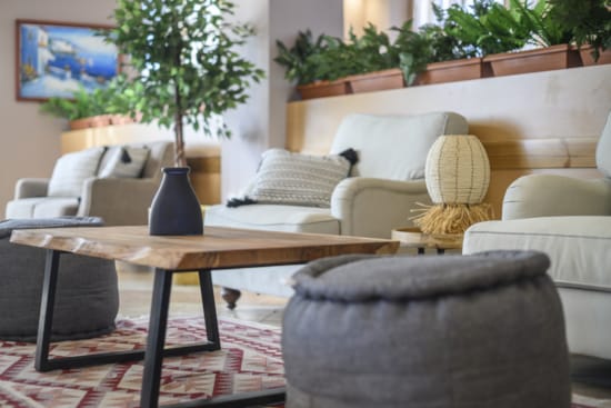 a living room with a coffee table and chairs