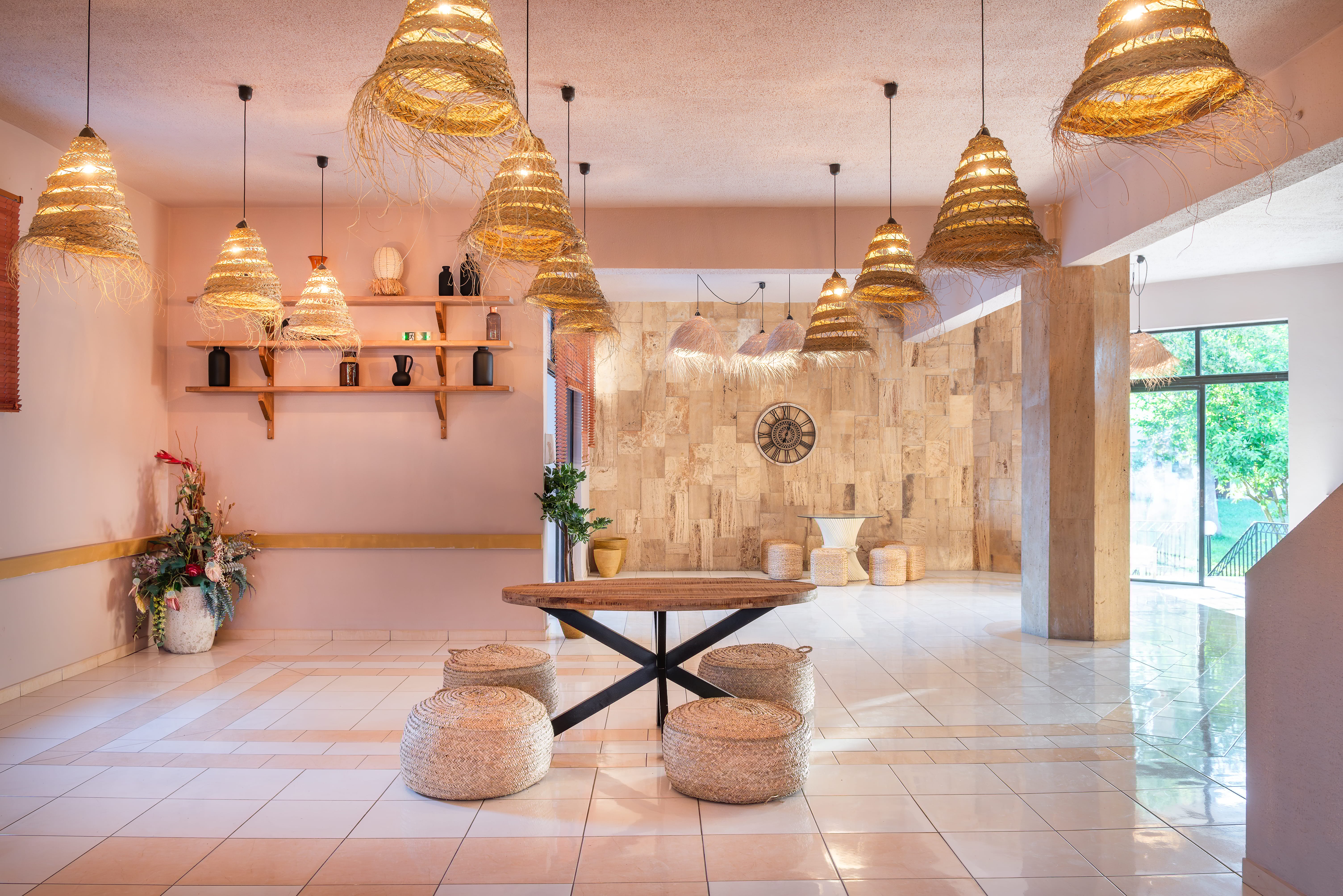 a room with a table and chandeliers