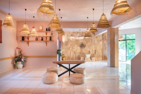 a room with a table and chandeliers