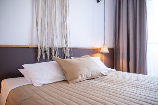 a bed with white pillows