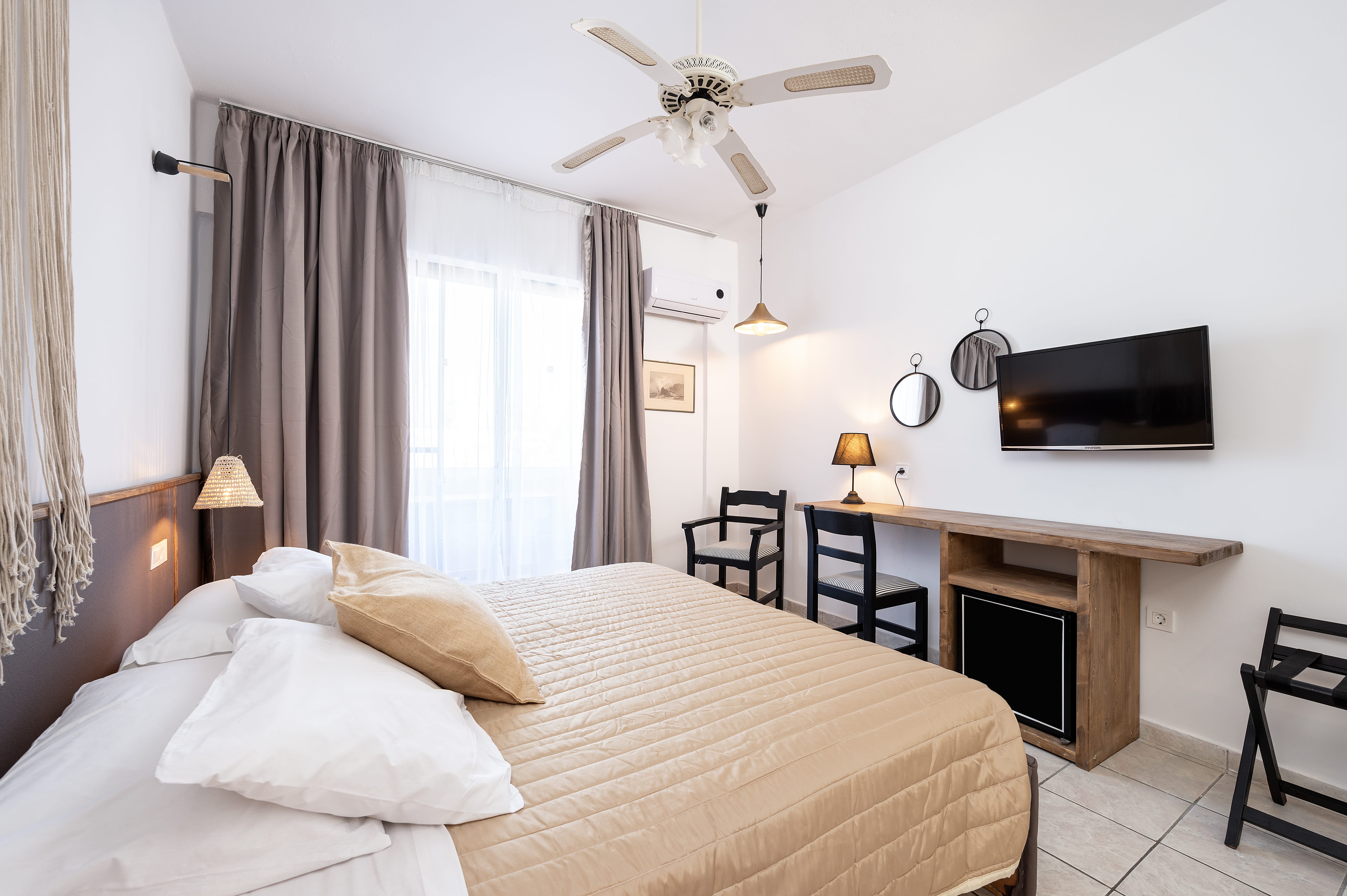 a bedroom with a bed and a desk