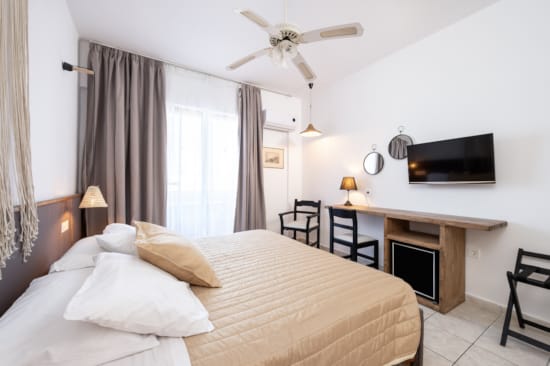 a bedroom with a bed and a desk