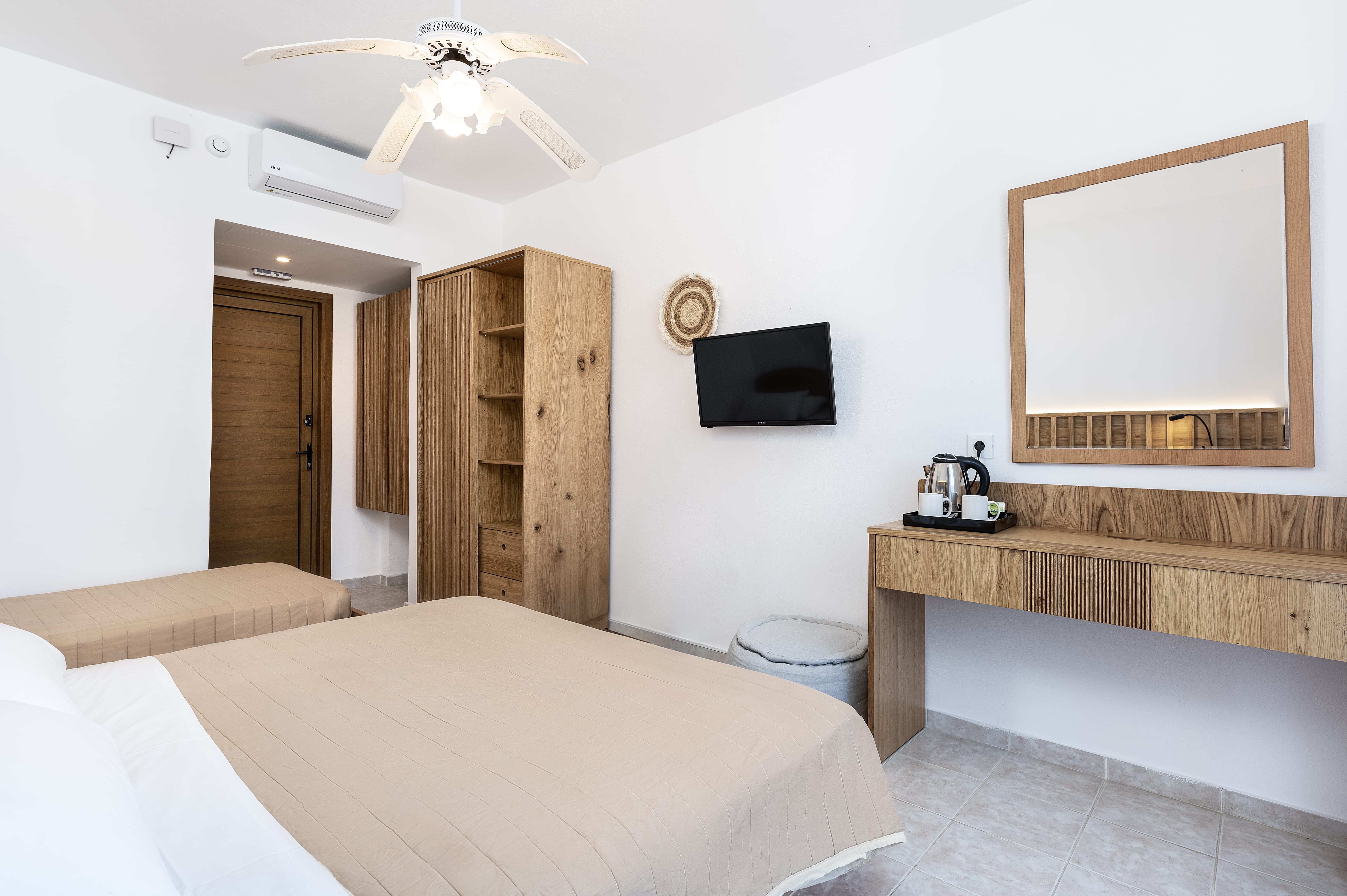 a room with a bed and a tv