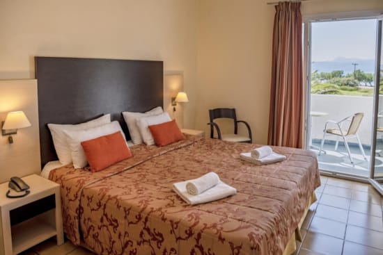 a hotel room with a large bed