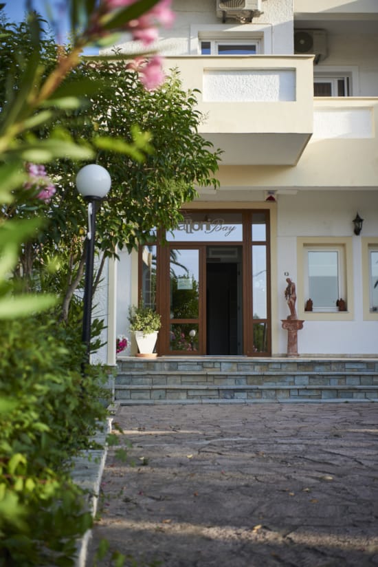 a building with a stone walkway