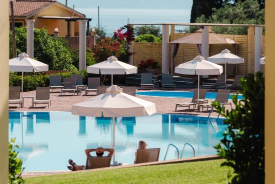 a pool with umbrellas and chairs