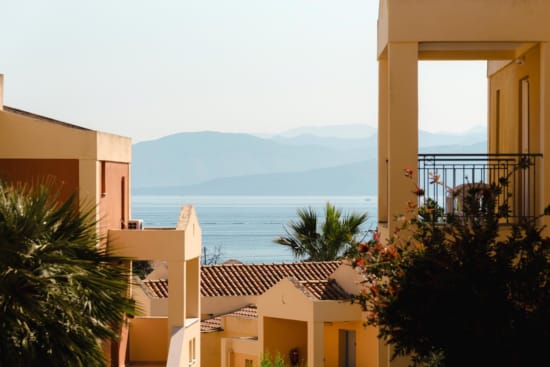 a view of a resort with a body of water
