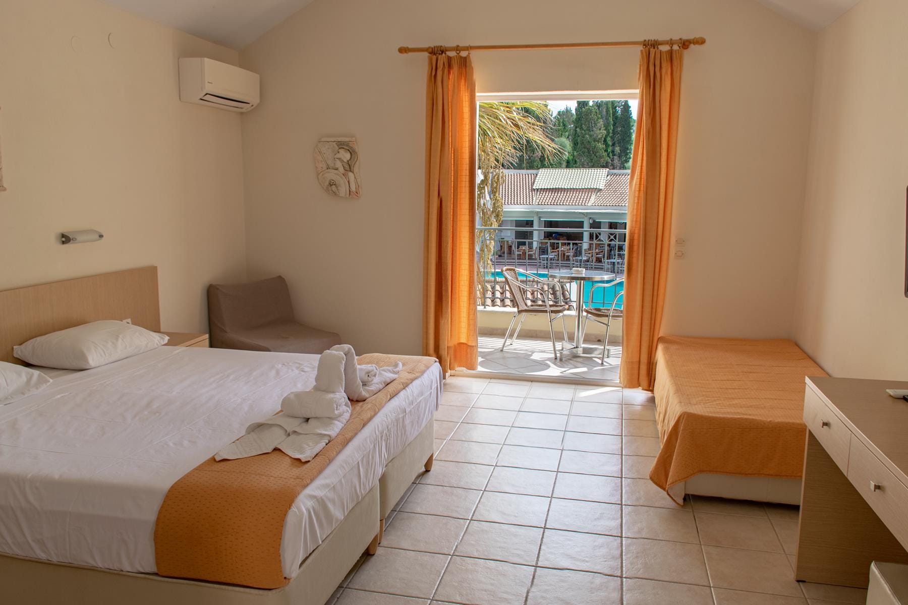 a bedroom with a large window